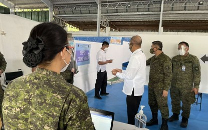 <p><strong>INSPECTION.</strong> National Defense Secretary Delfin Lorenzana (3rd from right) visits the official kickoff of the immunization campaign against Covid-19 at the Victoriano Luna Medical Center (also known as V. Luna) in Quezon City Monday (March 1, 2021). The country’s first 600,000 doses of China-donated Sinovac vaccine arrived on Sunday (Feb. 28). <em>(Photo courtesy of DND)</em></p>