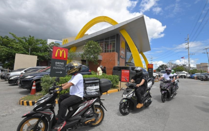 <p>‘<strong>ALLSTAR’ RIDERS</strong>. AirAsia employees serve as riders to deliver McDonald's food within Metro Manila on Monday (March 1, 2021). Former and current employees of AirAsia Philippines have the chance to work part time in the carrier's logistics arm, Teleport. <em>(Photo courtesy of AirAsia Philippines)</em></p>
