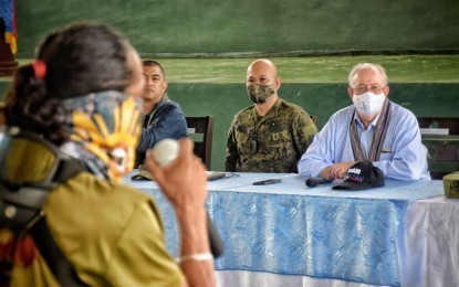 <p style="font-weight: 400;"><strong>REINTEGRATION PROGRAM.</strong> Australian Ambassador to the Philippines Steven J Robinson AO and Lt. Gen. Corleto Vinluan, Commander of the Western Mindanao Command, talk to former Abu Sayyaf Group (ASG) members during a historic trip to Sulu in the last week of February. The Australian government is looking to fund an aid program in Sulu to help former ASG members rejoin society. <em>(Photo courtesy of Australian Embassy in Manila via Western Mindanao Command)</em></p>