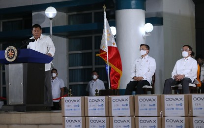 <p><strong>ASTRAZENECA VACCINES</strong>. President Rodrigo Duterte thanks 13 country donors as he receives the 487,200 doses of AstraZeneca vaccines through COVAX Facility at the Villamor Air Base in Pasay City on Thursday night (March 4, 2021).  Duterte urged the Filipinos to be the government’s partners in ending pandemic by getting inoculated with Covid-19 vaccines. <em>(PNA photo by Joey Razon)</em></p>