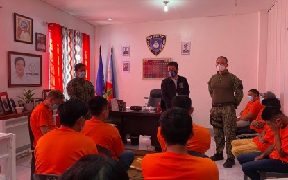 <p><strong>'SEXTORTION' DEN BUSTED.</strong> Fourteen individuals were arrested while several computer sets were seized after police operatives discovered an alleged cybersex extortion den in a rented apartment in Barangay Abar 1st, San Jose City, Nueva Ecija on Wednesday night (March 3, 2021). Policemen discovered the place when they pursued drug suspect Ronnie Wagan who ran to the apartment to elude arrest during a drug buy-bust operation. <em>(Contributed photo)</em></p>