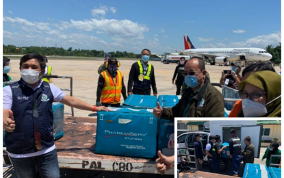 <p><strong>VACCINE ARRIVAL.</strong> Dr. Amirel Usman (left), BARMM acting health chief, and other health officials receive the 4,200 doses of Sinovac anti-Covid 19 vaccines from the national government that arrived via a PAL commercial flight at Awang airport in Datu Odin Sinsuat, Maguindanao on Thursday (March 3, 2021). The health officials (inset) also supervise the loading of the vaccines onto refrigerated vehicles for storing and immediate transport to BARMM province-component areas. <em>(Photo by PNA Cotabato)</em></p>