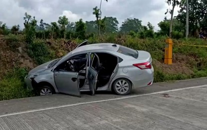 <p><strong>AMBUSH.</strong> Photo shows the silver Toyota Vios sedan the three policemen from Koronadal City were riding when they were ambushed Friday morning (March 5, 2021) along the national highway in Barangay Polonuling, Tupi town in South Cotabato. Its driver, Staff Sgt. Renante Espero, died on-the-spot due to multiple gunshot wounds while his two companions, Staff Sgts. Rey Jerome Silvederio and Jorex Velasco, were wounded in the attack. <em>(Contributed photo)</em></p>