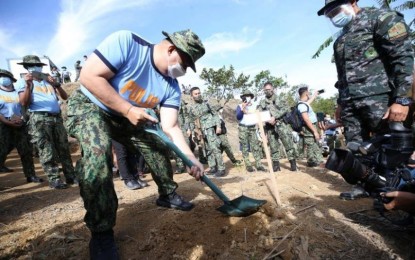 <p><strong>ECO WARRIORS.</strong> The Philippine National Police and Department of Environment and Natural Resources take active steps to reforest a portion of the Marikina Watershed Area in Rizal in January. Some 10,000 assorted seedlings of hardwood and fruit-bearing species were planted. <em>(Photo courtesy of PNP Facebook)</em></p>