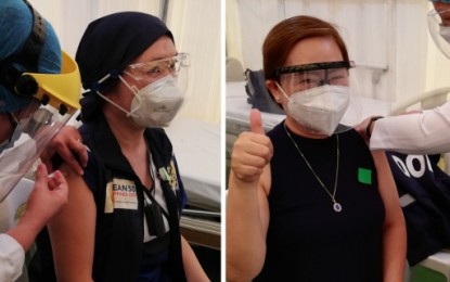 <p><strong>INITIAL SHOTS</strong>. Chief nurse Marybeth Marcial (left) and Dr. Joan Cerrada, planning chief of the Hospital Emergency Incident Command System at the Corazon Locsin Montelibano Memorial Regional Hospital in Bacolod City, take the initial shots of  CoronaVac vaccines during the ceremonial inoculation on Monday (March 8, 2021). Some 800 hospital personnel are expected to be vaccinated in the next five days<em>. (PNA photo by Nanette L. Guadalquiver) </em></p>
<p> </p>
<p> </p>