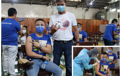 <p><strong>VACCINATED.</strong> Dr. Hamir Hechanova (left) flashes the “V” sign for "vaccinated" with Kidapawan Mayor Joseph Evangelista standing beside him. Hechanova (inset), chief of the Kidapawan City Hospital, was the first “vaccinee” for the city following the anti-Covid-19 vaccination rollout on Monday (March 8, 2021). <em>(Photo courtesy of Kidapawan CIO)</em></p>