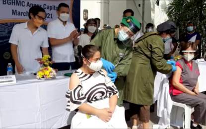 <p><strong>CEREMONIAL VACCINATION</strong>. Officials of the Bataan General Hospital and Medical Center receive the first dose of Sinovac vaccines in a ceremonial inoculation held on Monday (March 8, 2021). A total of 417 out of 2,680 doses of Sinovac vaccines allocated for Bataan were delivered to the province on Saturday.<em> (Photo by Ernie Esconde)</em></p>