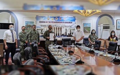 <p><strong>INSURGENCY FREE.</strong> Commander of the 2nd Infantry Division, Maj. Gen. Greg Almerol (4th from left), and Batangas Governor Hermilando Mandanas (3rd from right) lead the ceremony for the signing of a memorandum of agreement at the Provincial Capitol on Wednesday (March 10, 2021). Batangas was declared as an area with "stable internal peace and security" due to the absence of recorded New People's Army (NPA) violent activities for at least one year. <em>(Photo courtesy of 2nd Infantry Division, Philippine Army)</em></p>