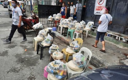 <p><strong>LOCALIZED LOCKDOWN.</strong> The Makati City government prepares food assistance to be provided to Barangay Pio del Pilar residents affected by a three-day lockdown that began Saturday (March 13, 2021). A house-to-house swab testing will be conducted. <em>(Photo courtesy of Makati PIO)</em></p>