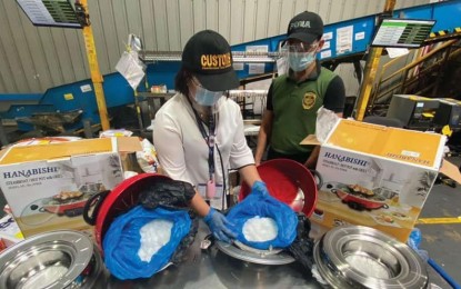 <p><strong>ILLEGAL SHIPMENT.</strong> Bureau of Customs and Philippine Drug Enforcement Agency-Region 3 operatives intercept an illegal drug shipment during a controlled delivery operation in Sta. Maria, Bulacan on March 5, 2021. The Supreme Court has approved the Rule on the Destruction and Disposal of Seized Dangerous Drugs, Other Substances, and Instruments Prior to the Filing of an Information. <em>(Photo courtesy of BOC)</em></p>