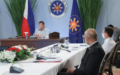 <p><strong>MOBILE VACCINATION</strong>. President Rodrigo Roa Duterte discusses the government’s latest response to the Covid-19 pandemic during his meeting with several Cabinet members and public address on Monday night (March 15, 2021). Duterte said he wants government agencies to provide mobile vaccination in the slum areas. <em>(Presidential photo by Toto Lozano)</em></p>
