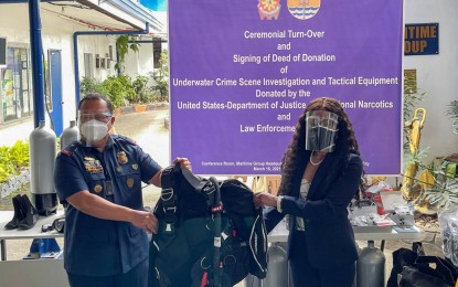 <p><strong>US DONATION</strong>. The Philippine National Police-Maritime Group Director, Brig. Gen. John Jamili (left), shows the donated equipment alongside US Embassy in the Philippines Director for International Narcotics and Law Enforcement Affairs Kelia Cummins. The US government donated PHP3.65 million worth of equipment on March 15, 2021 to strengthen the country's maritime law enforcement capabilities. <em>(Photo by US Embassy in Manila)</em></p>