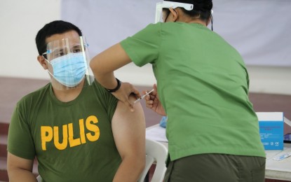 <p><strong>PRIORITY JAB.</strong> The Philippine National Police resumed its vaccination rollout using AstraZeneca in Camp Crame, Quezon City on Monday (March 15, 2021). Medical front-liners and elderly staff were among the first in the police force to get the vaccines. <em>(Photo courtesy of PNP-PIO)</em></p>