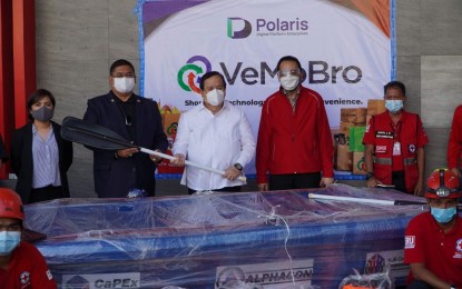 <p><strong>LIFE-SAVING EQUIPMENT</strong>. Philippine Red Cross (PRC) Chairman and CEO, Senator Richard Gordon (center), receives life-saving equipment donated by VeMoBro E-Commerce, Capex Cargo, and VJB Construction Corporation in this undated photo. The PRC also received three rescue boat donations worth PHP300,000 each. <em>(Contributed photo)</em></p>