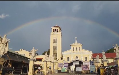 <p><strong>MINOR BASILICA</strong>. A rainbow appears in the sky above the Minor Basilica of Our Lady of the Rosary of Manaoag on March 1, 2021. The Minor Basilica is the most visited site in Pangasinan by pilgrims and Catholic devotees from all over Luzon. <em>(Photo screenshot from Minor Basilica of Our Lady of Manaoag's Facebook page)</em></p>