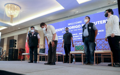 <p>NTF-RTF ELCAC MEETING. President Rodrigo Roa Duterte shows a gesture of respect as he takes center stage during the Joint National Task Force-Regional Task Force to End Local Communist Armed Conflict (NTF-RTF ELCAC) Region 8 meeting at the Summit Hotel in Tacloban City, Leyte on Thursday (March 18, 2021). Duterte took pride in his success in toppling oligarchy.<em> (Presidential photo by Karl Norman Alonzo)</em></p>
<p> </p>