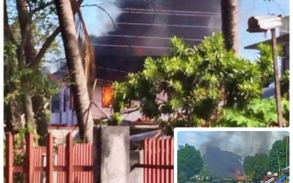 <p><strong>CLASH.</strong> A house burns in Barangay Kitango, Datu Saudi Ampatuan, Maguindanao following an encounter between government forces and BIFF terrorists on Thursday (March 18, 2021). Military armored personnel carriers (inset) maneuver on the middle of the highway in Kitango during the height of the 10 a.m. to 3 p.m. clash in the area to shield fleeing villagers. <em>(Photos courtesy of RMN – Cotabato and DXMS Radio Cotabato)</em></p>