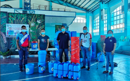 <p><strong>POTABLE WATER</strong>. DOST Ilocos Norte Director Engr. Benjamin S. Mercado leads the distribution of 150 pieces of water filter system in Dumalneg, Ilocos Norte on March 12, 2021. The kits are valued at PHP600,000. (<em>Photo courtesy of DOST</em>) </p>