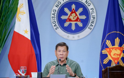 <p><strong>INDEMNITY CLAUSE.</strong> President Rodrigo Roa Duterte talks to the people after holding a meeting with the Inter-Agency Task Force on the Emerging Infectious Diseases (IATF-EID) core members at the Malago Clubhouse in Malacañang Park, Manila on Monday (March 22, 2021). Duterte said he found “holes” under the indemnity clause in vaccine procurement contracts that require government to assume liability for private sector-procured vaccines. <em>(Presidential photo by King Rodriguez)</em></p>