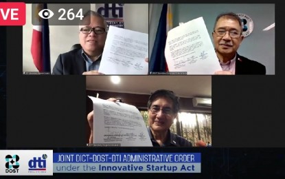 <p><strong>STARTUP ACT STEERING COMMITTEE. </strong>DTI Secretary Ramon Lopez, DOST Secretary Fortunato de la Peña, and DICT Secretary Gregorio Honasan sign the joint administrative order (JAO) to create a steering committee (SC) for the implementation of the Innovative Startup Act on Monday (March 22, 2021). The SC will provide strategic guidance and oversight in the formulation, implementation and development of the Philippine Startup Development program. (<em>Screenshot of JAO virtual signing</em>) </p>