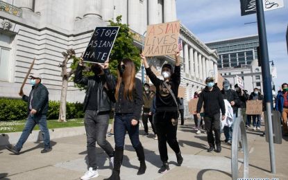 <p>STOP ASIAN HATE. People take part in a protest against Asian hate in front of the city hall of San Francisco, California, the United States, on March 22, 2021. Eight people, six of whom were Asian and two were white, were killed in three shooting incidents in massage parlors in the Atlanta area by a suspect. (Photo by Li Jianguo/Xinhua)</p>
