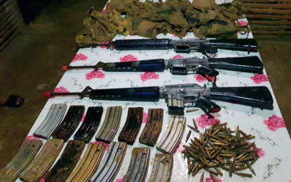 <p><strong>SEIZED.</strong> The assorted firearms discovered by government soldiers in North Cotabato after they were led Tuesday (March 23, 2021) by captured New People's Army rebels to the site where the insurgents hid their weapons. The recovered firearms consisted of three M16 rifles as well as magazine clips, bandoliers, and ammunition.<em> (Photo courtesy of 72IB)</em></p>