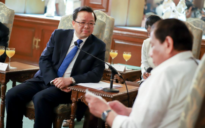 <p><strong>SOCIAL CALL</strong>. President Rodrigo Roa Duterte reads a document while discussing matters with Ambassador of the People's Republic of China to the Philippines Huang Xilian who paid a courtesy call on the President at the Malacañan Palace on March 11, 2020. Malacañang on Thursday (March 25, 2021) said Huang has paid “social call” on Duterte and assured that the Philippines need not worry over the reported presence of Chinese vessels in Julian Filipino Reef which is within the country’s exclusive economic zone <em>(Presidential file photo)</em></p>