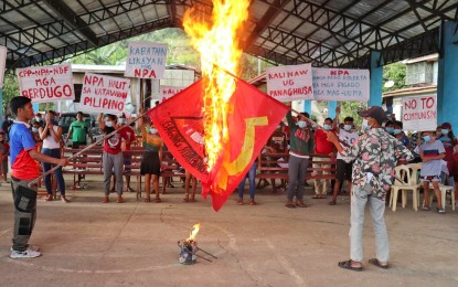<p><strong>PEACE RALLY.</strong> Residents of Barangay Bandila, Toboso in Negros Occidental witness the burning of CPP-NPA flags during a peace rally Friday (March 26, 2021). They denounced the presence of communist terrorist groups in their communities. <em>(Photo courtesy of Army 79IB)</em></p>