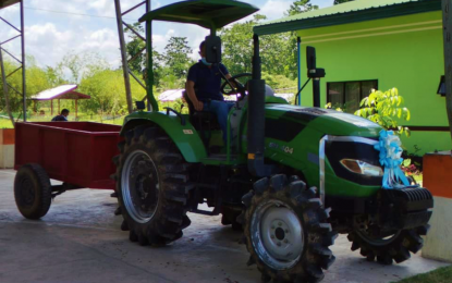 <p><strong>FARM TRACTOR.</strong> The Tibao Farmers Association in M’lang, North Cotabato, is expected to increase productivity and profit with a brand new four-wheel-drive diesel tractor with a rotavator and trailer courtesy of the Department of Agrarian Reform. The provincial DAR office is targeting at least five big farmer groups in the province to help increase rice and other crop production in arable lands.<em> (Photo courtesy of DAR-NoCot)</em></p>