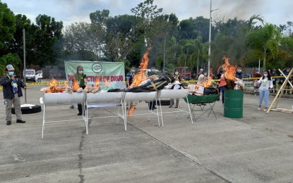 <p><strong>GO UP IN FLAMES</strong>. The Philippine Drug Enforcement Agency in Region 11 (PDEA-11) burns the PHP32.5 million worth of illegal drugs seized in the Davao Region on Monday (March 29, 2021) at the Davao del Sur Provincial Capitol Grounds in Digos City, Davao del Sur. A statement released on Tuesday (March 30, 2021) said PDEA-11 director Antonio Rivera led the burning of the confiscated drugs.<em> (Photo courtesy of PDEA-11)</em></p>