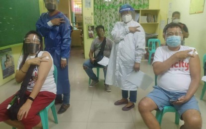 <p><strong>VACCINATED.</strong> Pasay residents under the A3 priority group receive Sinovac jabs on Tuesday (March 30, 2021). The city government targets to complete the inoculation of the A2 (elderly) and A3 (individuals with comorbidities) lists within the week. <em>(Photo courtesy of Pasay-PIO)</em></p>