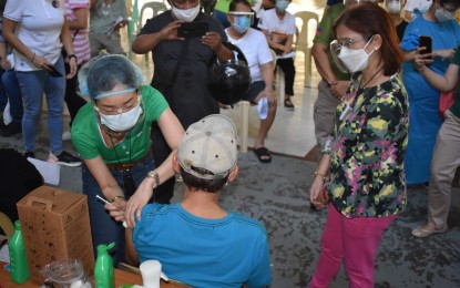 <p><strong>SUCCESSFUL.</strong> Pasay Mayor Emi Calixto-Rubiano (right) visits one of the city's vaccination sites for the elderly and persons with comorbidities on Wednesday (March 31, 2021). Rubiano says the trust and confidence of residents make the city's vaccination drive a success. <em>(Photo courtesy of Pasay PIO)</em></p>