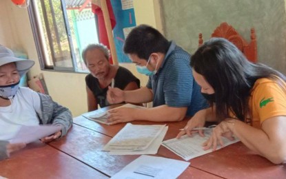 <p><strong>FARMERS' LIST</strong>. Registration of coconut farmers in Tunga, Leyte in this April 5, 2021 photo. The Philippine Coconut Authority (PCA) is eyeing to complete the registration of about 404,000 coconut farmers in Eastern Visayas by mid-June as the government braces for the utilization of coconut levy trust fund. <em>(Photo courtesy of PCA Region 8)</em></p>