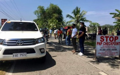 <p><br /><strong>MAYOR ON DUTY</strong>. San Remigio, Antique Mayor Margarito Mission Jr. (right) supervises a checkpoint during the start of the courtesy lockdown in the province of Antique on Monday (April 5, 2021). The people in Antique are discouraged to go out from their respective municipalities for 15 days to prevent the further spread of the Covid-19 cases in the province.<em> (Photo courtesy of San Remigio LGU)</em></p>