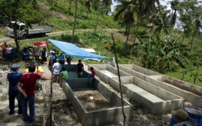 <p><strong>AID FOR FARMERS</strong>. The Department of Labor and Employment (DOLE) in Central Visayas provides almost half a million-peso livelihood aid to a farmers' group in Dumanjug town, southern Cebu to fund a vermicomposting endeavor. In the photo, farmers are shown supervising their site for vermicomposting, a process that uses earthworms to convert organic waste into fertilizer. <em>(Photo courtesy of DOLE-7)</em></p>