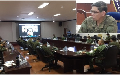 <p><strong>ON ALERT</strong>. Members of the military and the police in the Central Visayas region are seen in this April 5, 2021 meeting of the Regional Joint Peace and Security Coordinating Center-7 (RJPSCC-7). Maj. Gen. Eric Vinoya (inset), commander of the 3rd Infantry (Spearhead) Division of the Philippine Army, said soldiers and policemen are on alert against possible retaliatory attacks of the New People's Army (NPA) following the death of 10 terrorist rebels in an encounter in Guihulngan City, Negros Oriental last March. <em>(PNA photos by John Rey Saavedra and 3rd ID Public Affairs Office)  </em></p>