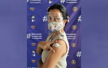 <p><strong>GRATEFUL VACCINEE</strong>. TV host and Unicef Goodwill Ambassador Daphne Oseña-Paez poses after getting her first dose of CoronaVac in Parañaque City on April 7, 2021. Oseña-Paez is included in the government's A3 priority list for the coronavirus disease 2019 vaccine or people with comorbidities. <em>(Photo courtesy of Daphne Oseña-Paez)</em></p>