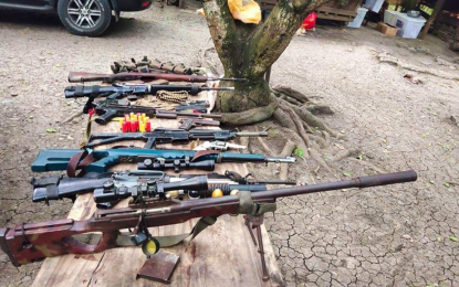 <p><strong>SEIZED</strong>. The assorted high-powered firearms seized from an alleged member of the Daesh-inspired Bangsamoro Islamic Freedom Fighters (BIFF) following the Army-led law enforcement operation in Pikit, North Cotabato on Saturday (April 10, 2021). The firearms consisted of an M16 rifle, M14 rifle, M1 Garand rifle, two 12-gauge shotguns, a .45 caliber pistol, a .38 caliber revolver, and ammunition.<em> (Photo courtesy of 6ID)</em></p>