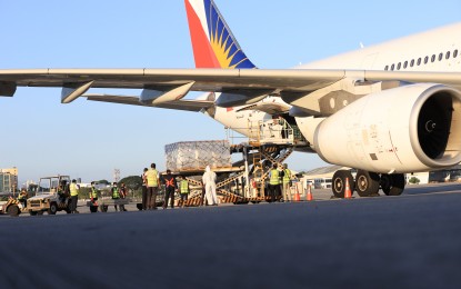 <p><strong>JUST ARRIVED.</strong> Sinovac vaccines are offloaded from a Philippine Airlines flight that flew in from Beijing on Sunday afternoon (April 11, 2021). Galvez said the country will receive 1.5 million doses this month and 2 million doses in May from Sinovac Biotech. <em>(PNA photo by Robert Oswald P. Alfiler)</em></p>