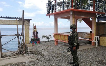 <p><strong>GCQ LOOMS.</strong> A policeman inspects a resort in Zamboanga City to ensure compliance with the order of the local Inter-Agency Task Force coronavirus disease 2019 (Covid-19) to temporarily stop operation amid the sudden rise in Covid-19 cases in this undated photo. The temporary closure of resorts has been extended until April 30. <em>(Photo courtesy of City Hall Public Information Office)</em></p>