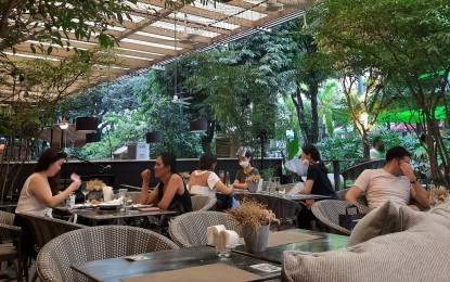 <p><strong>ALFRESCO.</strong> A restaurant in Makati City offers outdoor dining services in this undated photo. Outdoor dining is now allowed in areas under modified enhanced community quarantine. <em>(PNA photo by Kris Crismundo)</em></p>