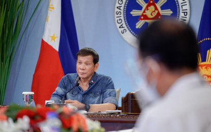 <p><strong>VACCINATION PRIORITY.</strong> President Rodrigo Roa Duterte talks to the people after holding a meeting with the Inter-Agency Task Force on the Emerging Infectious Diseases core members at the Malago Clubhouse in Malacañang Park, Manila on Monday night (April 12, 2021). Duterte said he is willing to waive getting a Covid-19 vaccine, saying it is better to prioritize those who need the vaccine to “live productively.” <em>(Presidential photo by King Rodriguez)</em></p>