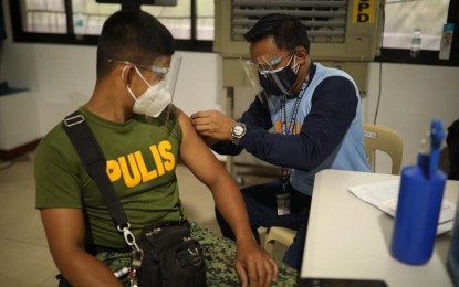 <p><strong>FRONT-LINERS.</strong> Members of the Quezon City Police District belonging to the A2 (senior citizens) and A3 (with comorbidities) groups participate in the vaccination drive on Monday (April 12, 2021). As of April 13, QC has already vaccinated 95,601 individuals. <em>(Photo courtesy of QC-PIO)</em></p>