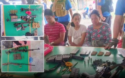 <p><strong>ARRESTED.</strong> Three of four arrested suspects of the alleged Manunggal lawless group sit in front of a table displaying the various high-power firearms seized from them following a joint military-police operation in Barangay Tee, Datu Salibo, Maguindanao early Wednesday (April 14, 2021). The alleged leader of the group, identified as Marcos Manunggal, a former chairman of Barangay Tee, was killed in a brief encounter between the gang members and the raiding team. <em>(Photo courtesy of Brigada News FM Cotabato)</em></p>
<p><em><strong> </strong></em></p>