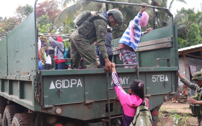 <p><strong>JOURNEY HOME.</strong> Evacuees board a military truck to return to their respective homes in Barangay Lamud, South Upi, Maguindanao on Tuesday (April 13, 2021) after the settlement of a long-drawn conflict between clans squabbling over vast tracts of land in the area. A total of 181 families have been living in evacuation centers for the past three months due to the clan war. <em>(Photo courtesy of 57IB)</em></p>
