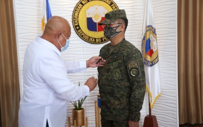 <p><strong>4-STAR GENERAL.</strong> DND Undersecretary Cesar Yano (left) leads the donning ceremony for AFP chief-of-staff, Gen. Cirilito Sobejana (right) in Camp Aguinaldo, Quezon City on Wednesday (April 14, 2021). President Rodrigo Duterte approved the promotion of Sobejana to the rank of General effective April 8 following the approval of the Commission on Appointments last March 24. <em>(Photo courtesy of AFP Public Affairs Office)</em></p>
