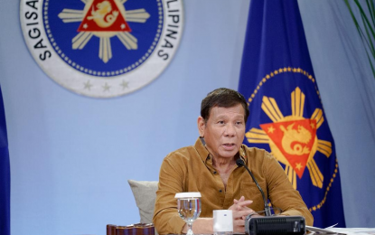 <p><strong>TALK TO THE PEOPLE</strong>. President Rodrigo Roa Duterte talks to the people after holding a meeting with the Inter-Agency Task Force on the Emerging Infectious Diseases (IATF-EID) core members at the Malacañang Golf (Malago) Clubhouse in Malacañang Park, Manila on Thursday (April 15, 2021). Duterte took a swipe at people who disagree with the use of Covid-19 vaccines. <em>(Presidential photo by King Rodriguez)</em></p>