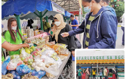 <p><strong>RAMADAN MARKET STALLS.</strong> A female food exhibitor attends to food buyers at the MAFARLENGKE market stalls inside the BARMM government center in Cotabato City on Wednesday afternoon (April 14, 2021). Muslims consume the food they buy for their daily breaking of the fast during the month of Ramadan.<em> (Photos courtesy of MAFAR-BARMM)</em></p>