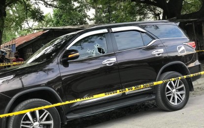 <p><strong>DEEPER PROBE.</strong> Photo shows the bullet-riddled driver’s side of the black Toyota Fortuner driven by former Palimbang, Sultan Kudarat town councilor Ebrahim Kadil Sabiwang, who was killed in a gun attack in Barangay San Isidro, General Santos City on Wednesday afternoon (April 14, 2021). Police have launched a deeper investigation into the incident. <em>(PNA photo by Richelyn Gubalani)</em></p>