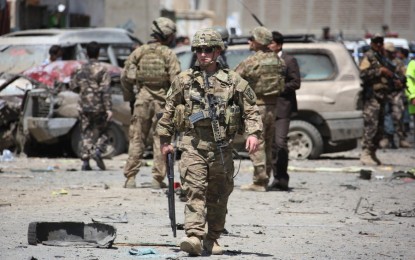 <p><strong>US TROOPS WITHDRAWAL.</strong> US soldiers inspect the site of suicide car bombing in Kabul, Afghanistan, May 17, 2015. President Joe Biden announced on Wednesday (April 14) that all US troops will be withdrawn from Afghanistan before Sept. 11, a decision to end the longest war in American history. <em>(Xinhua/Ahmad Massoud)</em></p>